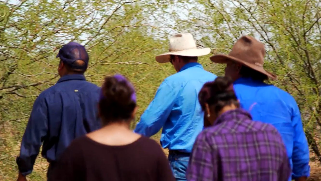 PACM team members with community members on Country